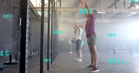 Exercising in gym, people using digital data overlay for tracking progress Stock Footage 329372519