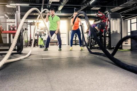 Exercising in gym Stock Photos