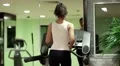 Exercising in gym, treadmill cardio workout. Woman walks on treadmill in the gym HD Footage