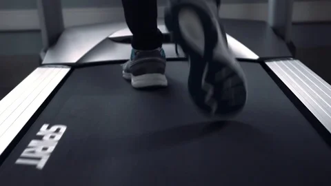 Exercising in the gym, treadmill cardio workout Stockbeeldmateriaal 77328301
