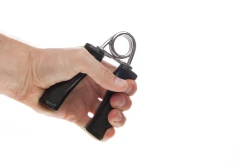 Exercising with a hand gripper. Stock Photos