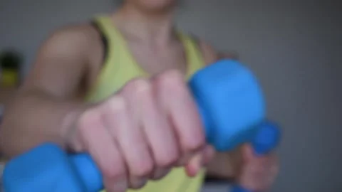 Exercising at home with dumbbells / barbells Stock Footage 165955372
