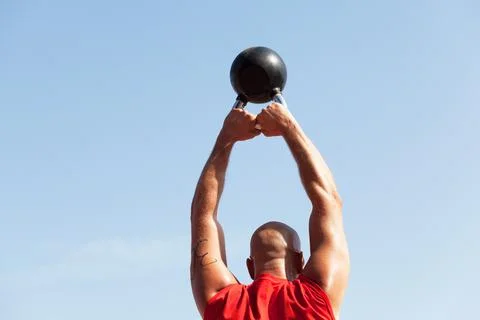 Exercising with a kettlebell Stock Photos