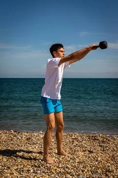 Exercising with a kettlebell weight Foto stock