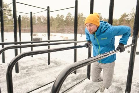 Exercising with parallel bars Stock-Fotos