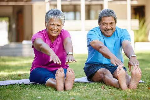 Exercising together couldnt be more enjoyable. Portrait of a mature couple doing Stock Photos