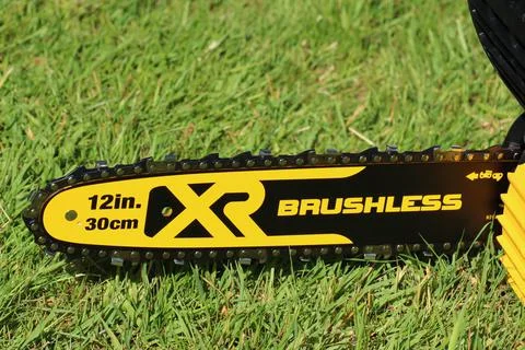 EXETER, DEVON, ENGLAND - JUNE 15TH 2021: Dewalt 18 volt cordless chainsaw on  Stock Photos