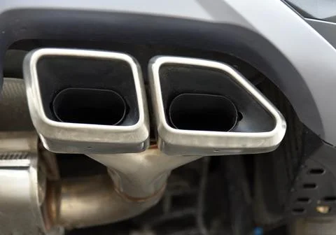 Exhaust pipe on a passenger car Stock Photos
