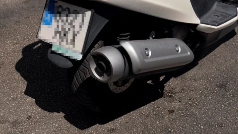 Exhaust pipe of a scooter Stock Footage 115775685