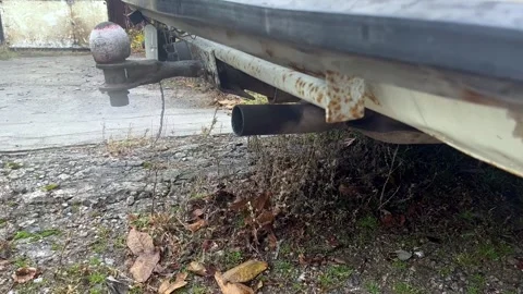 Exhaust. The started car stands still and emits exhausts. Stock Footage 279297882