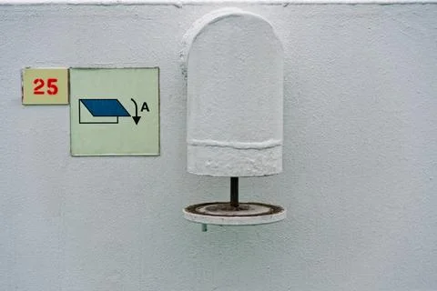 Exhaust vent pipe end with arrow sign and wall mark A 25 Stock Photos