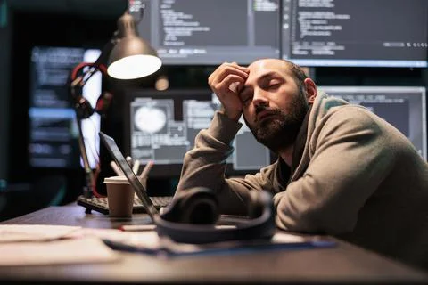 Exhausted app developer feeling sleepy late at night 스톡 사진