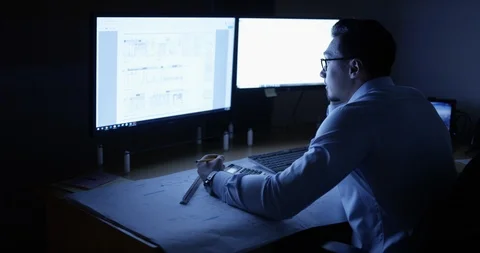 Exhausted architect at his desk Stock Footage 107643257