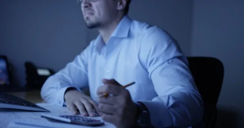 Exhausted architect at his desk Stock Footage 107643397