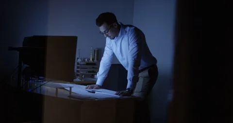 Exhausted architect at his desk Stock Footage 107644110