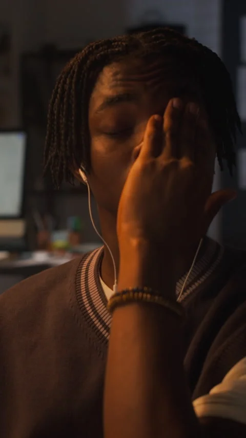 Exhausted Black Man Rubbing Eyes Working Late in Office Stock Footage 338418921