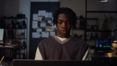 Exhausted Black Man Working Late on Laptop in Office Feeling Burnout Stock Footage 338415266