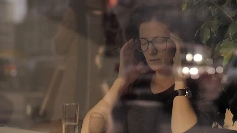 Exhausted business woman getting headache in late office. Overworked woman Stock Footage
