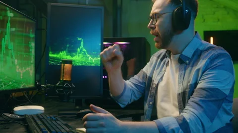 Exhausted Caucasian guy crypto trader broker man working overtime late night Stock Footage 295515193
