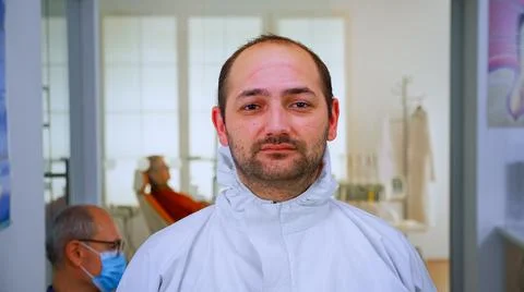 Exhausted doctor looking on camera without face mask Stock-Fotos