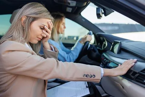 Exhausted Driving Instructor After Difficult Training Session Foto stock
