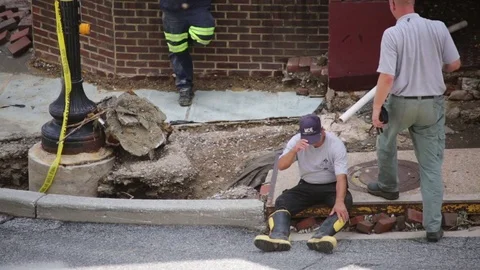 Exhausted emergency services worker at disaster site. Flood damage. Stock Footage 70539258