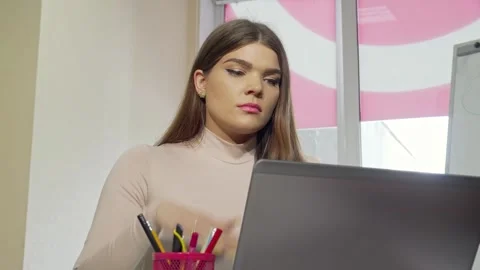 Exhausted female student stressed while working on a laptop Stock Footage 311931280