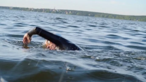 exhausted-female-swimmer-training-in-ope-stock-video-pond5