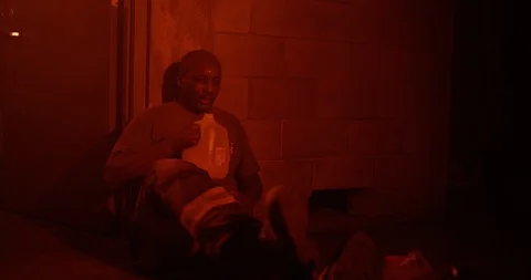 Exhausted firefighter drinking water after training Stock Footage 107624250