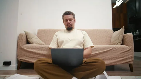 Exhausted freelancer falling asleep while working on a laptop at home Stock Footage 340931851