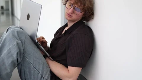 Exhausted freelancer falls asleep after hours of laptop work Stock Footage 338277647