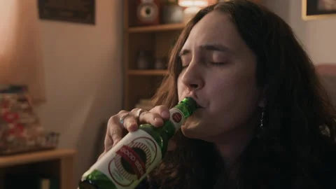 Exhausted Man Drinking Beer and Unwinding at Home after Work Stock Footage 338064807