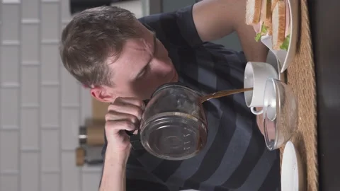 Exhausted man drinking coffee Stock Footage 228688697