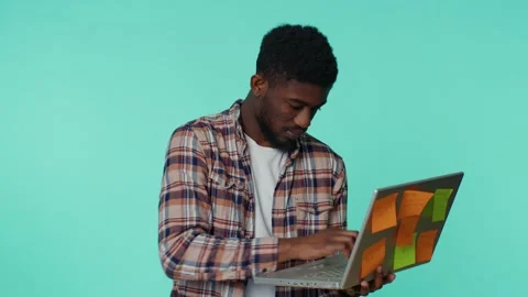 Exhausted man freelancer with pasted sticker notes using laptop computer Stock Footage 171209596