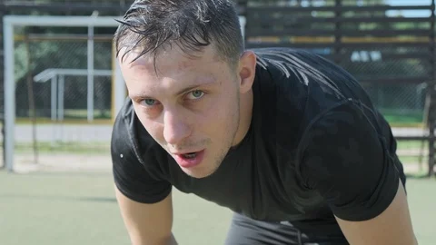 Exhausted man raises head. Close-up tired face and sweaty man finished workout Video stock 115030645