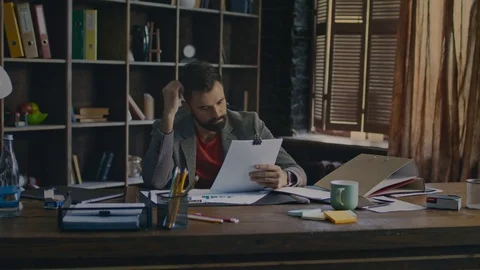 Exhausted man solving business problem. Office worker lies on table Stock Footage 84794409