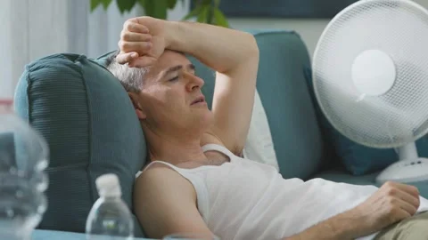 Exhausted man suffering from the heat Stock Footage 297860951