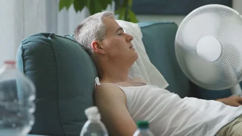 Exhausted man suffering from the heat Stock Footage 297860968