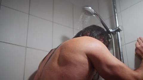Exhausted Man Supports Wall After Shower, Caucasian Man Appears Relieved After Stock Footage 323309128