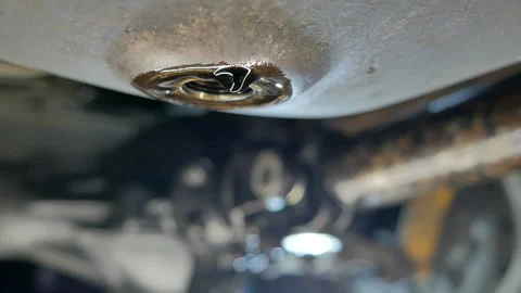 The exhausted oil flows out of the engine carter Stock Footage 124727469