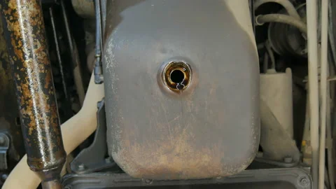 The exhausted oil flows out of the engine carter Stock Footage 124727935