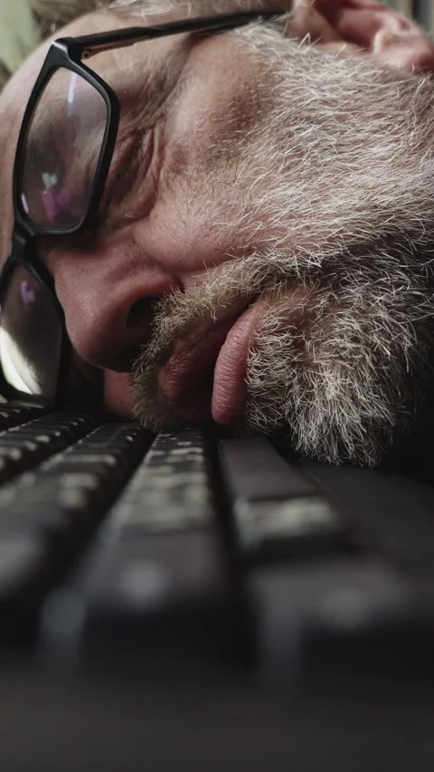 Exhausted Programmer Falls Asleep at Keyboard During Late Night Deadline Video stock 337762227