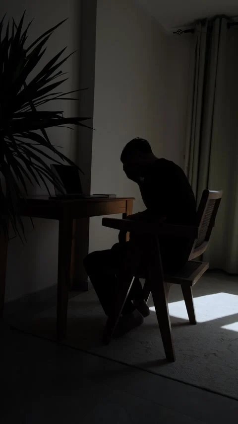 Exhausted remote worker sitting alone at home struggling with professional Stock-Footage 346243148