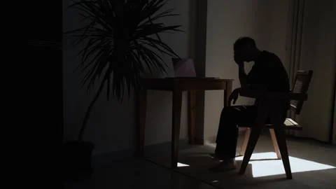 Exhausted remote worker sitting alone at home struggling with professional Vídeo Stock 346244286