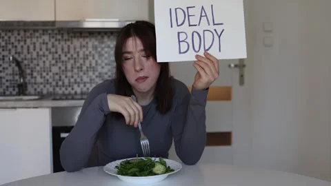 Exhausted from restrictive dieting Video stock 334576494