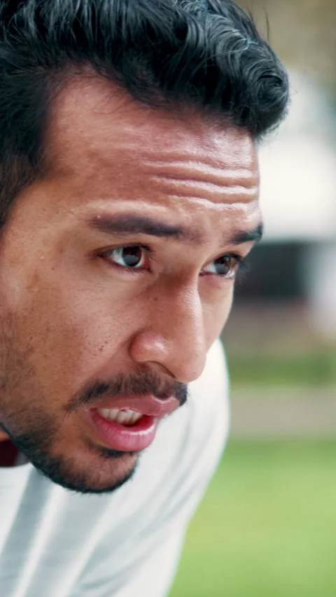 Exhausted, runner and man outdoor with sweat, exercise break and breathing for Stock Footage 333445792
