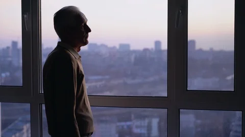 Exhausted sick man standing alone by window, health problems, loneliness crisis Stock Footage 122040506