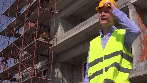 Exhausted tired engineer working wiping sweat remove hardhat helmet cooling down Stock Footage