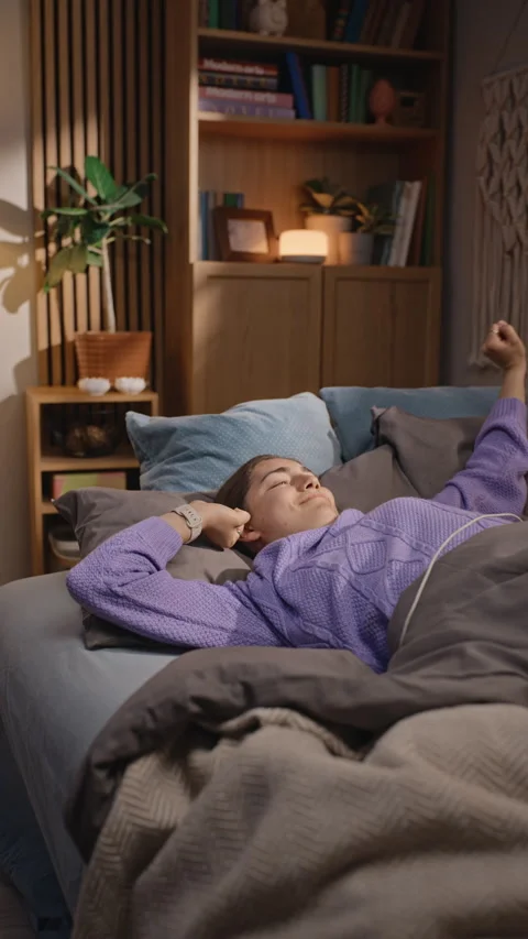 Exhausted Woman Waking up and Checking Sleep App on Smartwatch Stock Footage 344123858