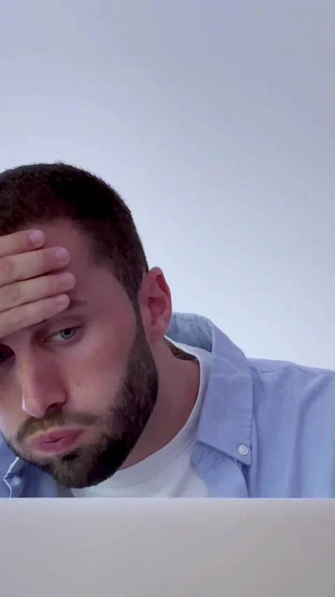 Exhausted young professional feeling overwhelmed and stressed while working Stock Footage 345117273